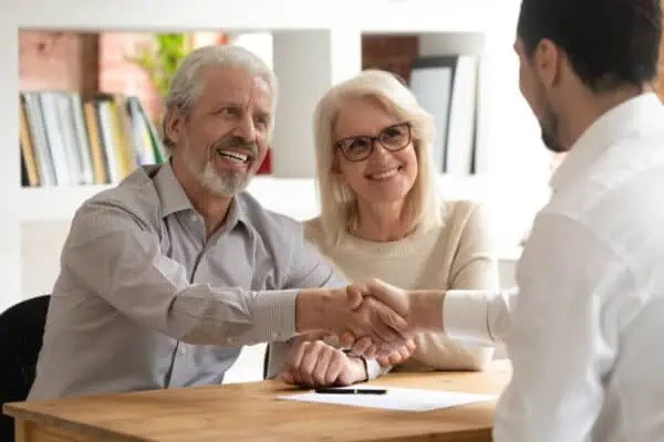 older couple talks about estate planning and funerals with a professional